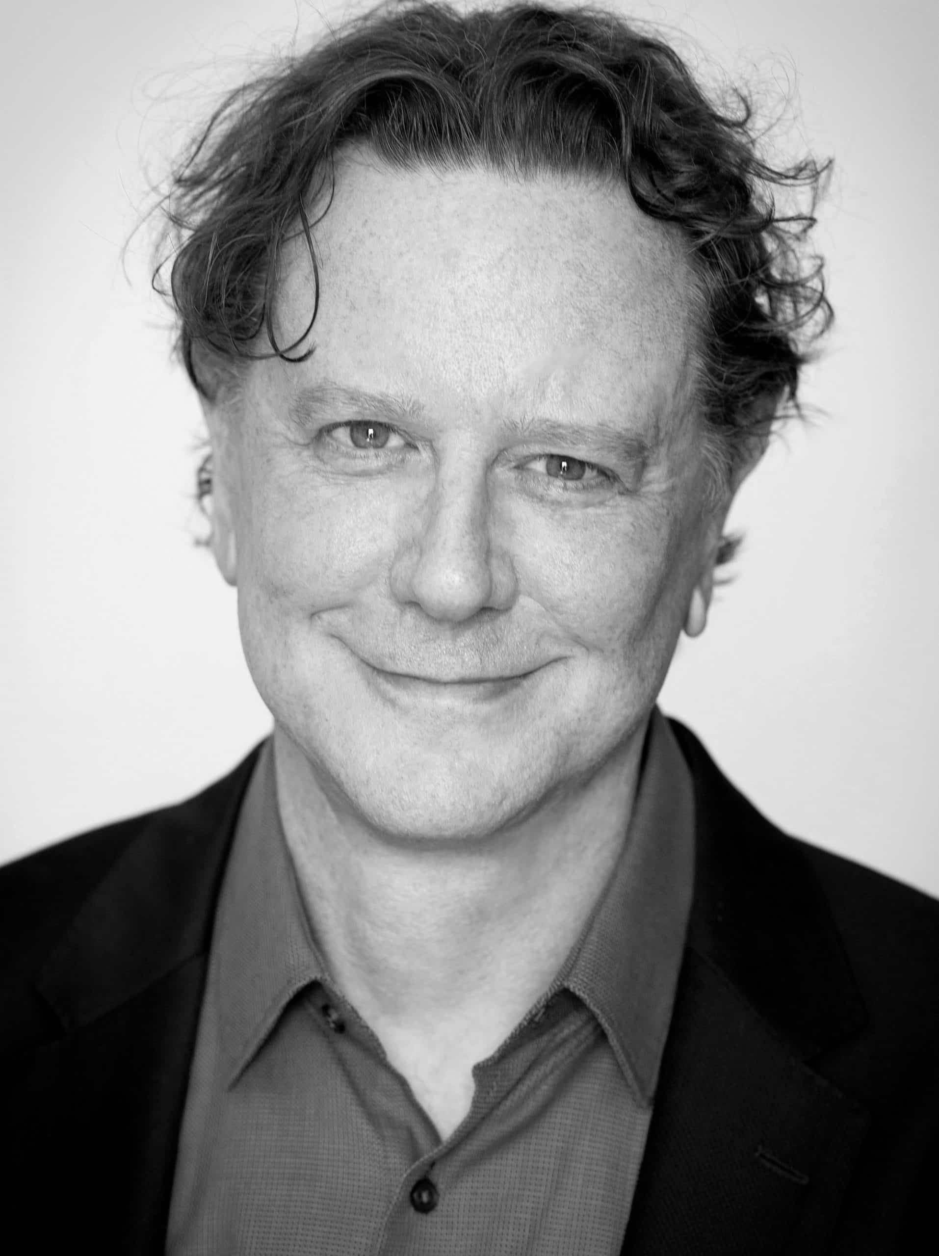 actor Judge Reinhold's headshot in black and white